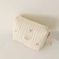 Trousse à langer matelassée brodée - Pochette nomade à clipser sur la poussette