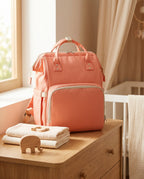 Sac à dos à langer nomade Tendrinette · Corail · scène nursery [c:corail]