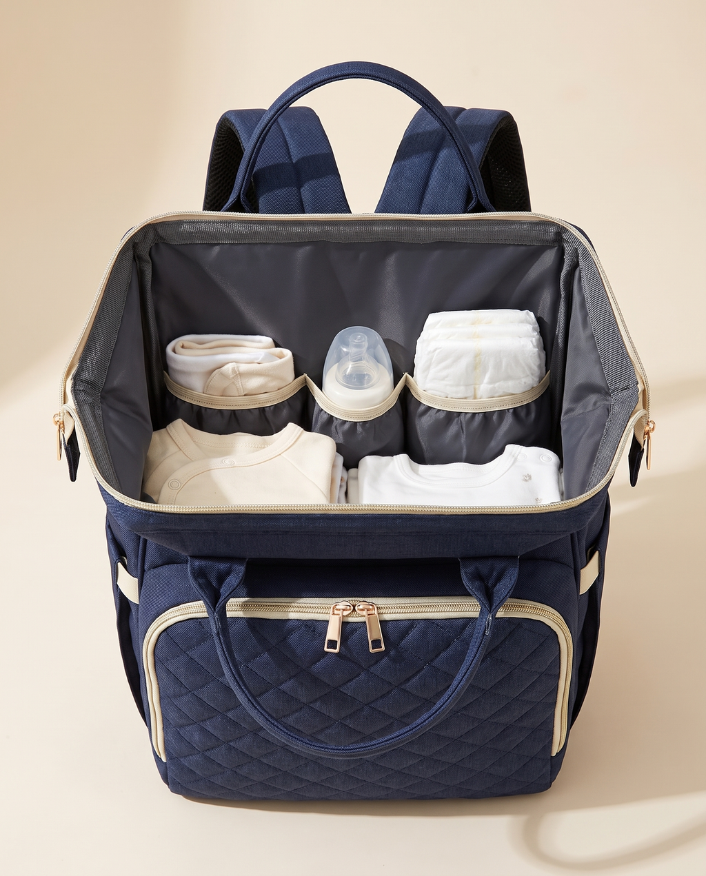 Sac à dos à langer bébé maternité matelassé Tendrinette · Bleu marine · intérieur ouvert et poches élastiquées